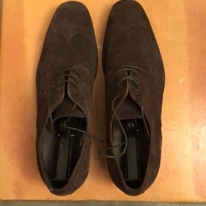 Men’s suede Hugo Boss lace-up dress shoes.